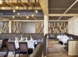 Restaurant confortable à l'hôtel Penzinghof avec un intérieur élégant et un design en bois naturel.