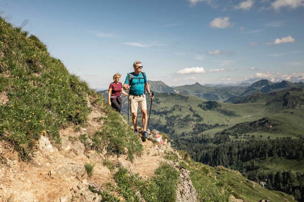 Hiking Couple in the Tyrolean Alps with Beautiful Scenery in the Background.